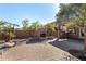 Charming backyard featuring a cozy fireplace, built-in grill, and beautiful pavers for outdoor enjoyment at 1314 W Windsong Dr, Phoenix, AZ 85045