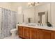 Well-lit bathroom with a double vanity and shower-tub combo at 1314 W Windsong Dr, Phoenix, AZ 85045