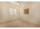 Bright bedroom with carpet, large windows with plantation shutters and neutral paint at 1314 W Windsong Dr, Phoenix, AZ 85045