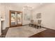 Bright living room with wood floors, neutral rug, and glass doors to the outdoor area at 1314 W Windsong Dr, Phoenix, AZ 85045