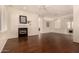 Spacious living room features hardwood floors, a fireplace, abundant light, and archway to the dining room at 1314 W Windsong Dr, Phoenix, AZ 85045