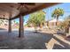 Covered patio with brick columns, fan, outdoor seating area, and pool at 1314 W Windsong Dr, Phoenix, AZ 85045