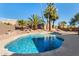 Sparkling blue pool surrounded by lush landscaping and desert scenery, perfect for outdoor relaxation and entertaining at 1314 W Windsong Dr, Phoenix, AZ 85045