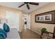 Bedroom featuring a day bed, ceiling fan, chair and view to other rooms in the home at 1403 E Las Colinas Dr, Chandler, AZ 85249