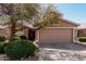 Charming single-story home with a two-car garage, desert landscaping, and a welcoming entrance at 1403 E Las Colinas Dr, Chandler, AZ 85249