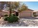 Inviting single-story home featuring desert landscaping, a wide driveway, and a two-car garage at 1403 E Las Colinas Dr, Chandler, AZ 85249