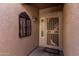 Cozy covered front porch with security door and decorative wrought iron window feature at 1403 E Las Colinas Dr, Chandler, AZ 85249