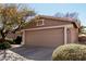 A clean, two-car garage features a neutral color scheme and complements the home's exterior at 1403 E Las Colinas Dr, Chandler, AZ 85249