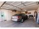 Spacious garage with built-in cabinets and a parked car, offering ample storage and parking at 1403 E Las Colinas Dr, Chandler, AZ 85249