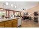 Open concept floorplan with kitchen island looking to the dining area and living room at 1403 E Las Colinas Dr, Chandler, AZ 85249