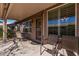 Covered patio features neutral colors and a seating area, great for relaxing outdoors at 1403 E Las Colinas Dr, Chandler, AZ 85249