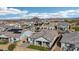 Charming suburban homes feature solar panels, fenced yards, and mountain views under a bright, partly cloudy sky at 14317 W Faye Way, Surprise, AZ 85387