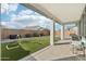 Covered patio overlooking the backyard with a lawn, perfect for outdoor relaxation and entertaining at 14317 W Faye Way, Surprise, AZ 85387