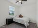 Bedroom with carpet flooring, a window and a bed at 14317 W Faye Way, Surprise, AZ 85387