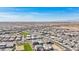 Wide aerial view of a residential community with desert landscapes and mountain views in the distance at 14325 W Faye Way, Surprise, AZ 85387