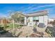 Charming backyard featuring gravel landscaping, desert plants and a covered patio with outdoor dining set at 14325 W Faye Way, Surprise, AZ 85387