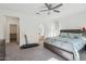 Bright primary bedroom with an en suite bath and neutral-colored walls at 14325 W Faye Way, Surprise, AZ 85387