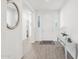 Bright and airy foyer with wood flooring, a white front door, and stylish decor at 14325 W Faye Way, Surprise, AZ 85387