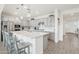 Modern kitchen with stainless steel appliances, a spacious island, and stylish pendant lighting at 14325 W Faye Way, Surprise, AZ 85387