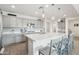 Bright kitchen showcasing a center island, stainless appliances, gray cabinets, and tiled backsplash at 14325 W Faye Way, Surprise, AZ 85387