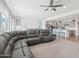 Open-concept living area with a large sectional sofa and seamless flow into the kitchen at 14325 W Faye Way, Surprise, AZ 85387