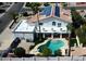 Aerial view of house with solar panels, spacious balcony, and a private swimming pool at 14401 N 29Th St, Phoenix, AZ 85032