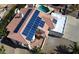 Aerial view of home featuring solar panels, tile roof, and paved patio with fountain at 14401 N 29Th St, Phoenix, AZ 85032