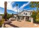 A view of the back exterior, with balconies overlooking the backyard and pool area, and tall palm trees at 14401 N 29Th St, Phoenix, AZ 85032