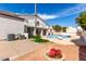 A view of the back exterior, with a diving board and pool area, with balconies and an expansive patio area at 14401 N 29Th St, Phoenix, AZ 85032