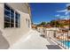 Balcony view overlooking pool with metal railings, blue sky, and stucco walls, offering a relaxing outdoor space at 14401 N 29Th St, Phoenix, AZ 85032