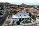 Aerial view of a home with solar panels, balcony, and refreshing swimming pool at 14401 N 29Th St, Phoenix, AZ 85032