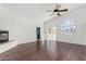 Spacious living room with fireplace, ceiling fan, and sliding glass doors to outdoor space at 14401 N 29Th St, Phoenix, AZ 85032