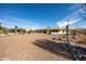 Spacious backyard featuring desert landscaping and view of the home's rear exterior and enclosed patio at 15602 N Nicklaus Ln, Sun City, AZ 85351