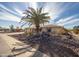 Lovely home with mature palm tree, desert landscaping, and a welcoming front porch at 15602 N Nicklaus Ln, Sun City, AZ 85351