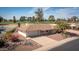 Charming single-story home boasts a two-car garage and manicured landscaping at 15602 N Nicklaus Ln, Sun City, AZ 85351