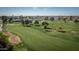 Aerial view of the community golf course with mature trees and green fairways at 15602 N Nicklaus Ln, Sun City, AZ 85351