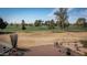 Scenic view of the community golf course with mature trees, green fairways and desert landscaping at 15602 N Nicklaus Ln, Sun City, AZ 85351