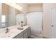 Functional bathroom featuring double sinks, well-lit vanity, and a shower-tub combination at 17632 W Voltaire St, Surprise, AZ 85388