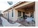 Spacious covered patio featuring comfortable seating, shade, and lovely outdoor ambiance at 17632 W Voltaire St, Surprise, AZ 85388