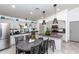 Bright kitchen featuring stainless steel appliances, an island, and a dining area, ideal for everyday meals and gatherings at 17632 W Voltaire St, Surprise, AZ 85388