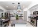 Well-lit kitchen featuring stainless steel appliances, ample counter space, and a functional design for cooking and meal prep at 17632 W Voltaire St, Surprise, AZ 85388