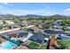 High angle shows houses in a neighborhood with views of the park and surrounding mountains under a sunny blue sky at 1840 N Brighton Cir, Mesa, AZ 85207