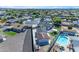 Aerial view of property showcasing pool, multiple garages and landscaping at 1840 N Brighton Cir, Mesa, AZ 85207