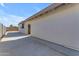 A long view of the side of the back of the house with an exterior door at 1840 N Brighton Cir, Mesa, AZ 85207