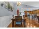 Dining room with hardwood floors, wainscotting, chandelier and vaulted ceiling at 1840 N Brighton Cir, Mesa, AZ 85207