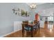 Dining room with hardwood floors, wainscotting, chandelier and vaulted ceiling at 1840 N Brighton Cir, Mesa, AZ 85207