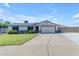 Beautiful single-story home featuring a wide driveway, a two-car garage, and a manicured front lawn at 1840 N Brighton Cir, Mesa, AZ 85207