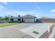 Lovely single-story home featuring a wide driveway, a two-car garage, and a manicured front lawn at 1840 N Brighton Cir, Mesa, AZ 85207