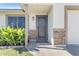 Inviting front entrance with a decorative security door, desert landscaping, and stacked stone accents at 1840 N Brighton Cir, Mesa, AZ 85207