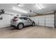 Clean garage interior with storage and vehicle parking space at 1840 N Brighton Cir, Mesa, AZ 85207